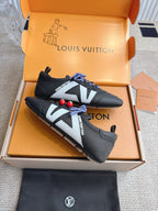 Louis Vuitton unisex sneakers, black leather with blue laces, red charms, and white V
