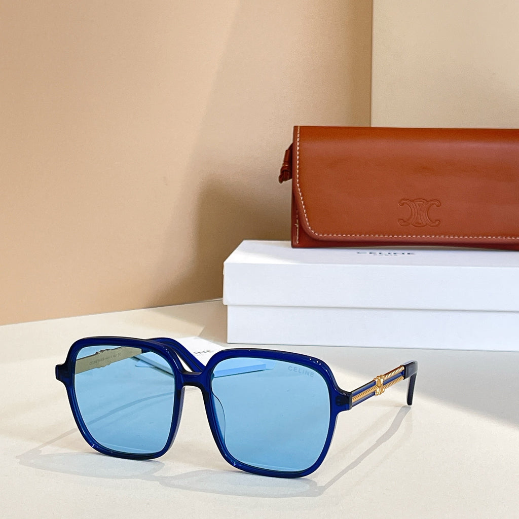Celine sunglasses with dark blue square frames and blue tinted lenses, gold hinges.