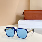 Celine sunglasses with dark blue square frames and blue tinted lenses, gold hinges.