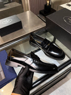 Black leather loafers with glossy finish, side view