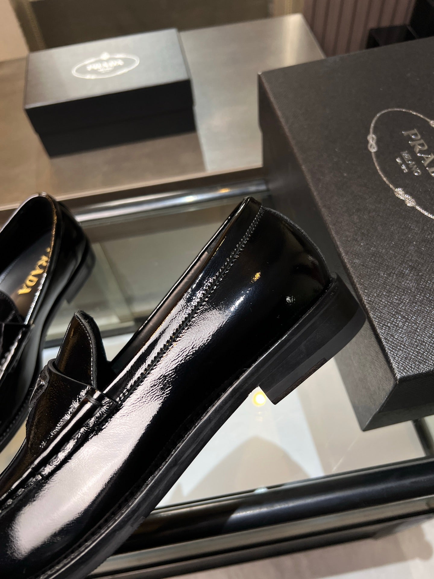 Prada unisex patent loafer, black glossy toe with stitched apron detail