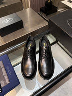 Black Prada unisex lace-up dress shoes, round toe, stitched welt and polished finish