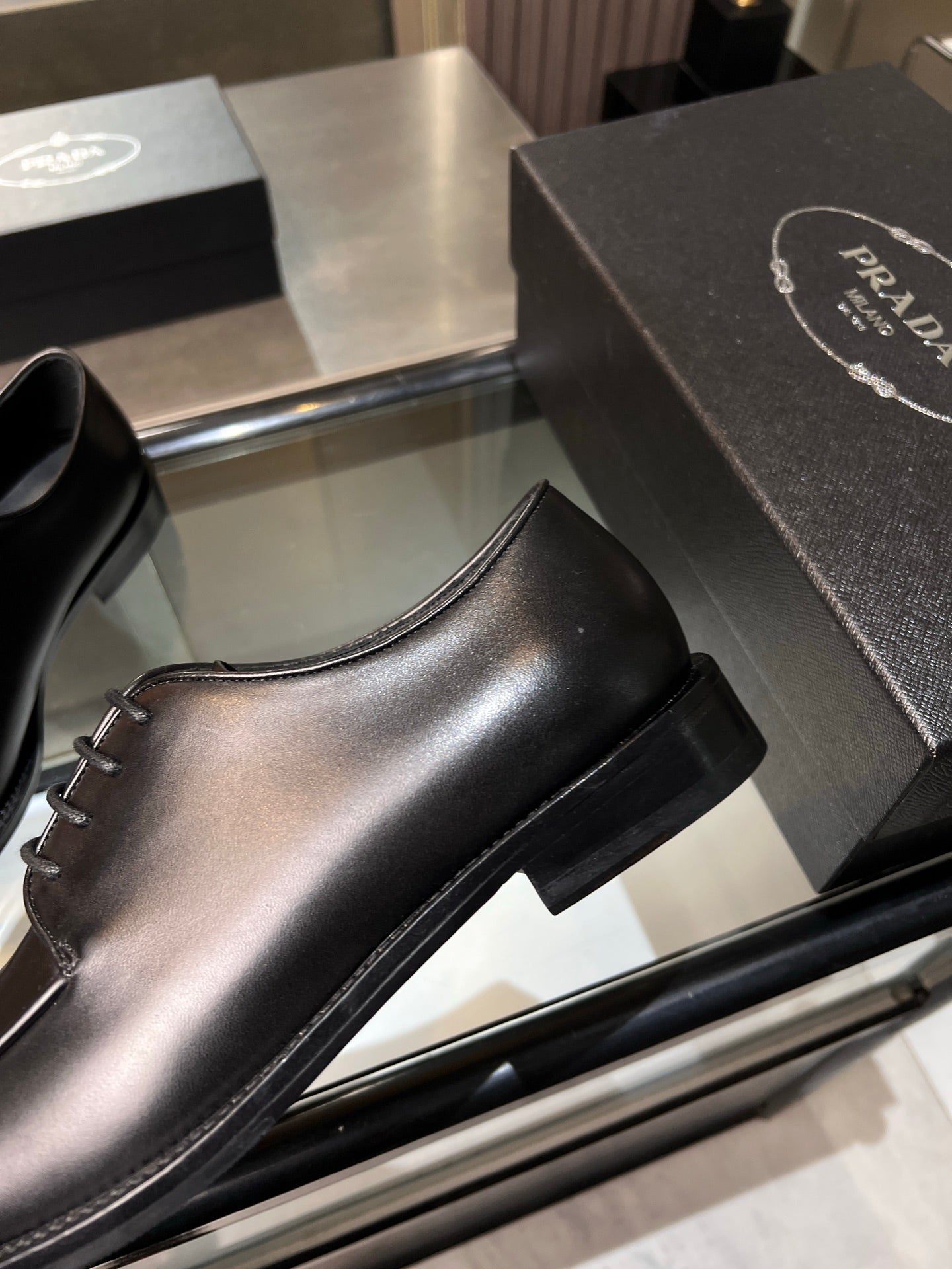 Black Prada unisex lace-up dress shoe, side profile with short stacked heel and sole
