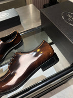 Brown leather slip-on loafer with rounded toe and stitched edge trim