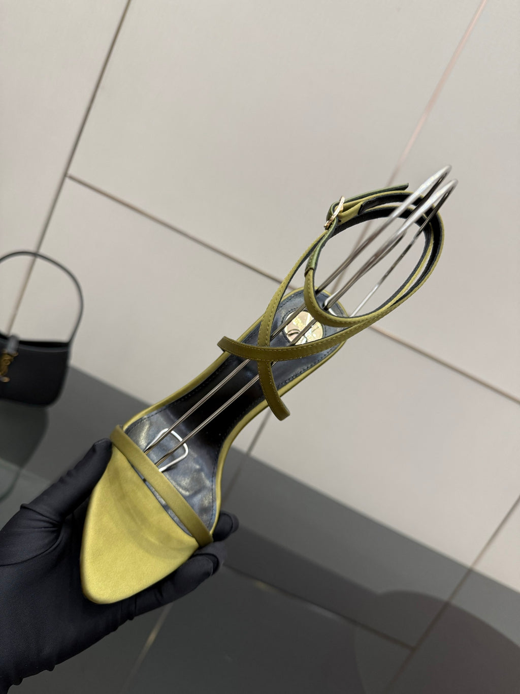 Designer high-heel sandal, yellow toe with green straps and open side profile