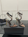 YSL women’s leopard-print heeled sandals with thin black straps and gold-tone stiletto heels