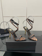 YSL women’s leopard-print heeled sandals with thin black straps and gold-tone stiletto heels