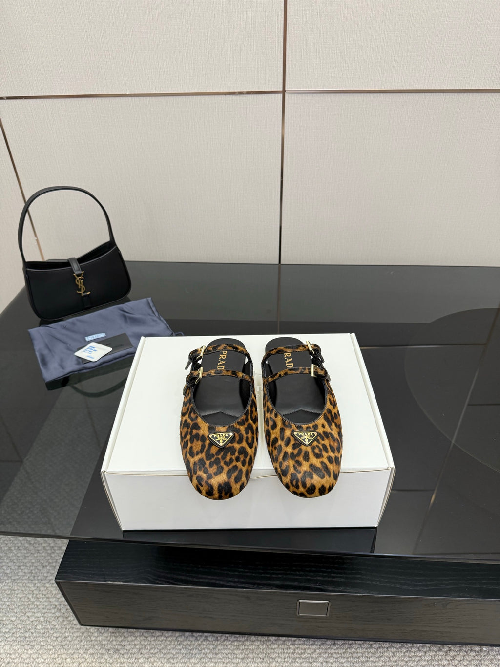 Prada ladies leopard-print flats with ankle strap and gold buckle detail