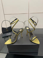 Designer high-heel sandals with lime-yellow toe and green cross-strap design