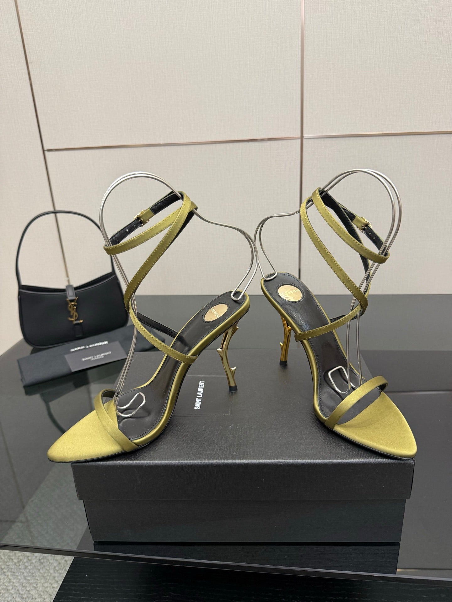 Designer high-heel sandals with lime-yellow toe and green cross-strap design