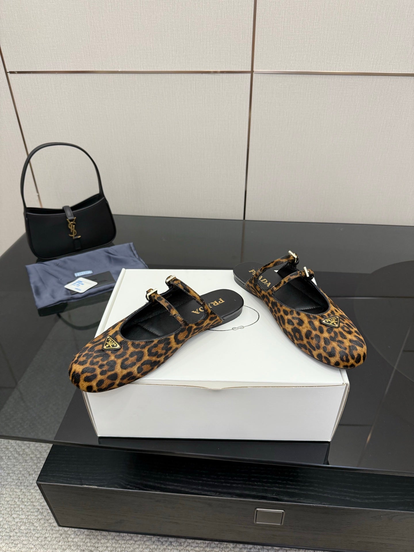 Prada ladies leopard-print slingback flats with ankle strap and gold buckle