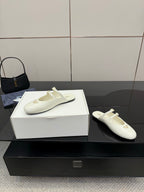 Women's Prada white leather flat with side profile, double buckle strap and logo patch