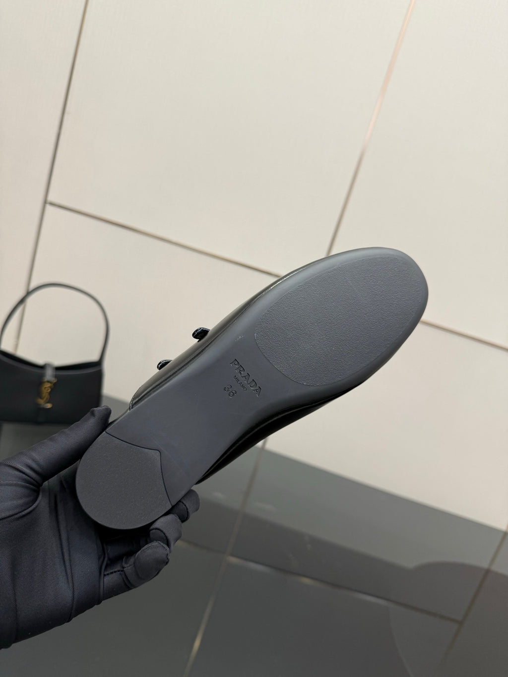 Women's Prada shoe sole in black with light logo text