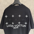 Louis Vuitton black T-shirt with white flower icons and 'LOUIS VUITTON PRAIS' on back