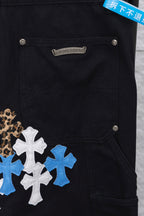 Dark pants with front pockets, snap buttons, and blue/white cross patches