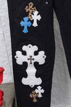 Black cargo pants with large white and blue cross patches on side seam