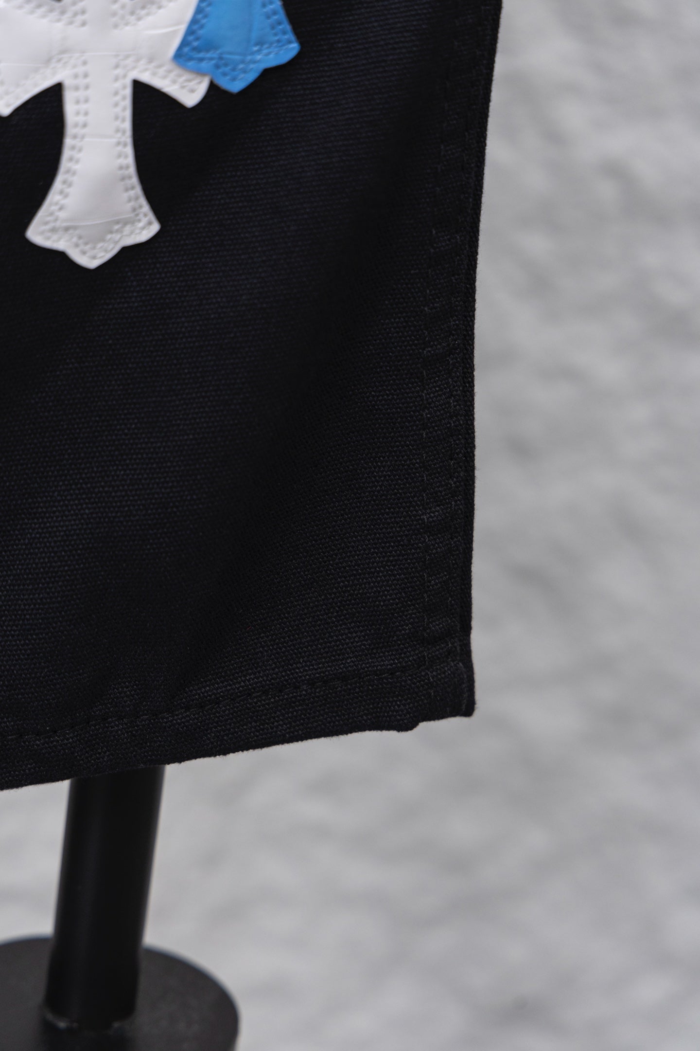 Black pants with side seam and tapered leg opening