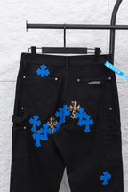 Black cargo pants with blue cross and leopard patches, waist and pockets