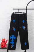 Black cargo pants with blue cross patches and leopard accent details