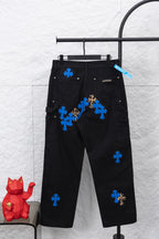 Black cargo pants with scattered blue cross and leopard patches, front view
