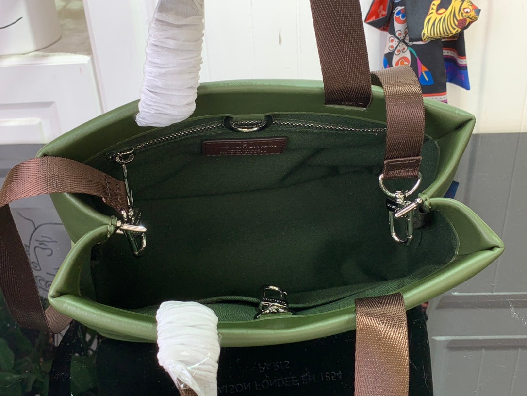 Louis Vuitton tote bag open top in dark olive green with brown handles and straps