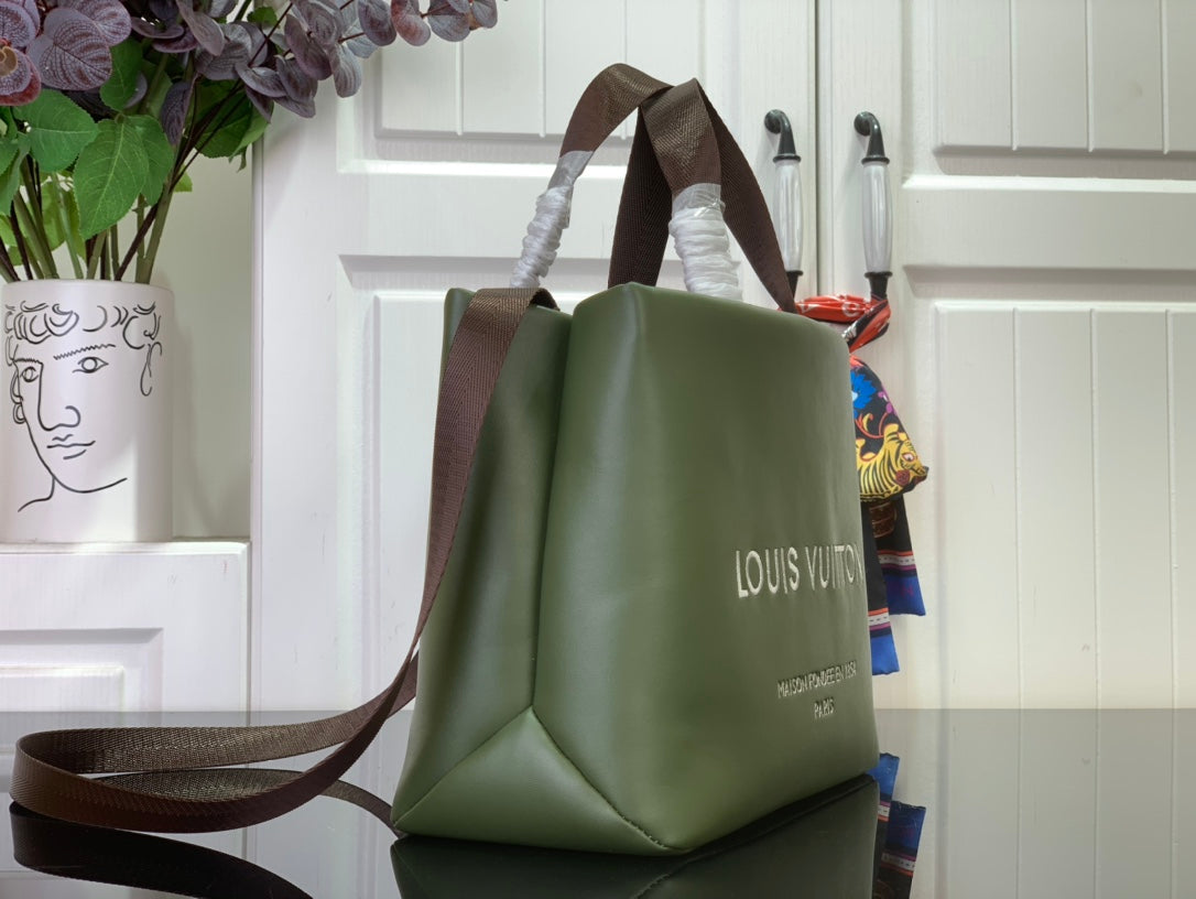Louis Vuitton tote bag in dark olive green with brown strap and side logo view