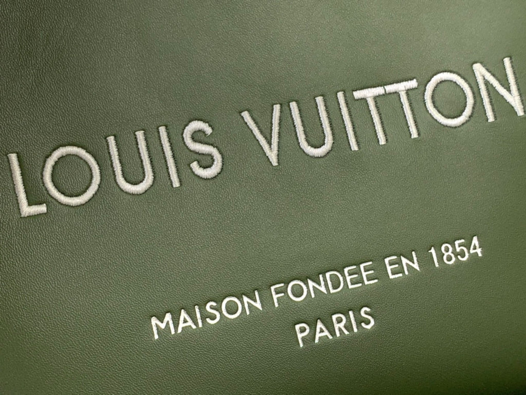 Louis Vuitton tote bag logo in white on dark olive green leather