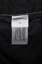 Black pants label and size tag with fabric care and measurement text