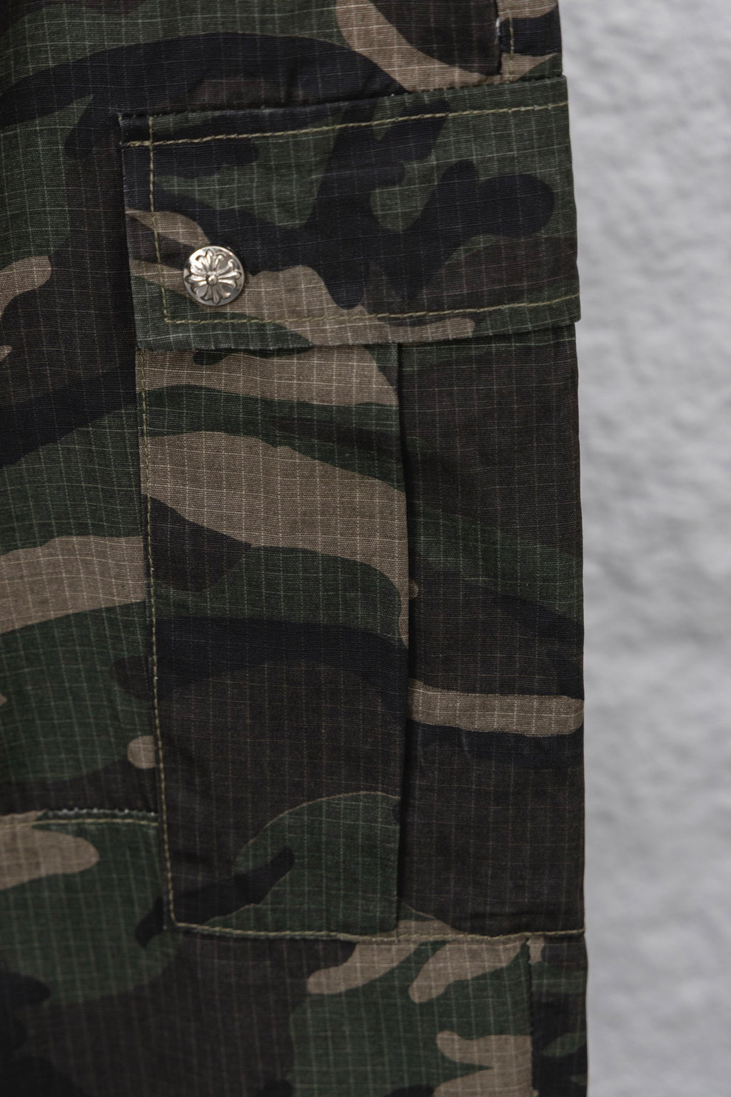Camouflage Chrome pants with buttoned fly and side pocket