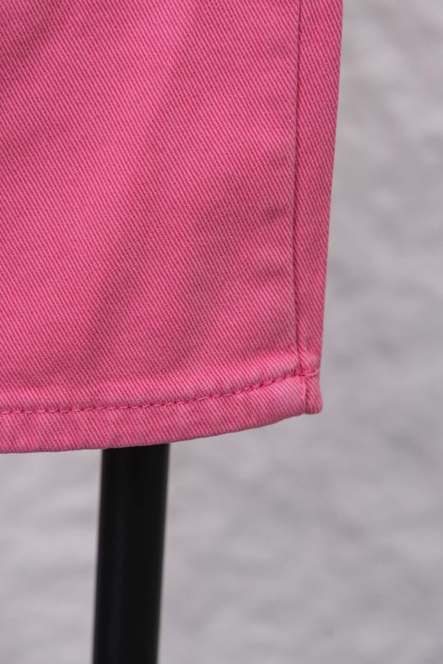 Pink pants cuff with stitched hem