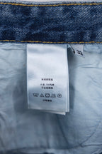 Denim inner care label on light blue fabric