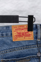 Denim waistband with a Levi Strauss & Co. size label and red quality markings