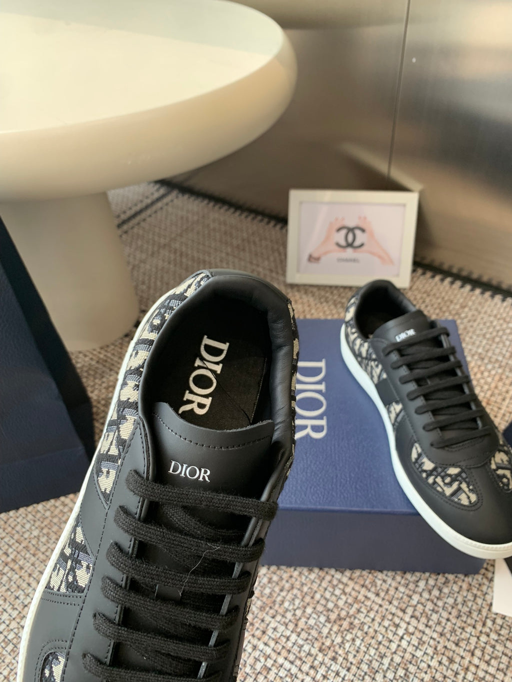 Dior unisex sneaker toe and lace detail, black with patterned side panel