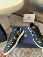 Dior unisex low-top sneakers, black with monogram-style inserts, white sole