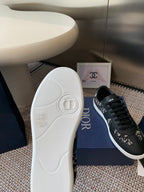 Dior unisex sneaker outsole and side view, white rubber sole on blue box