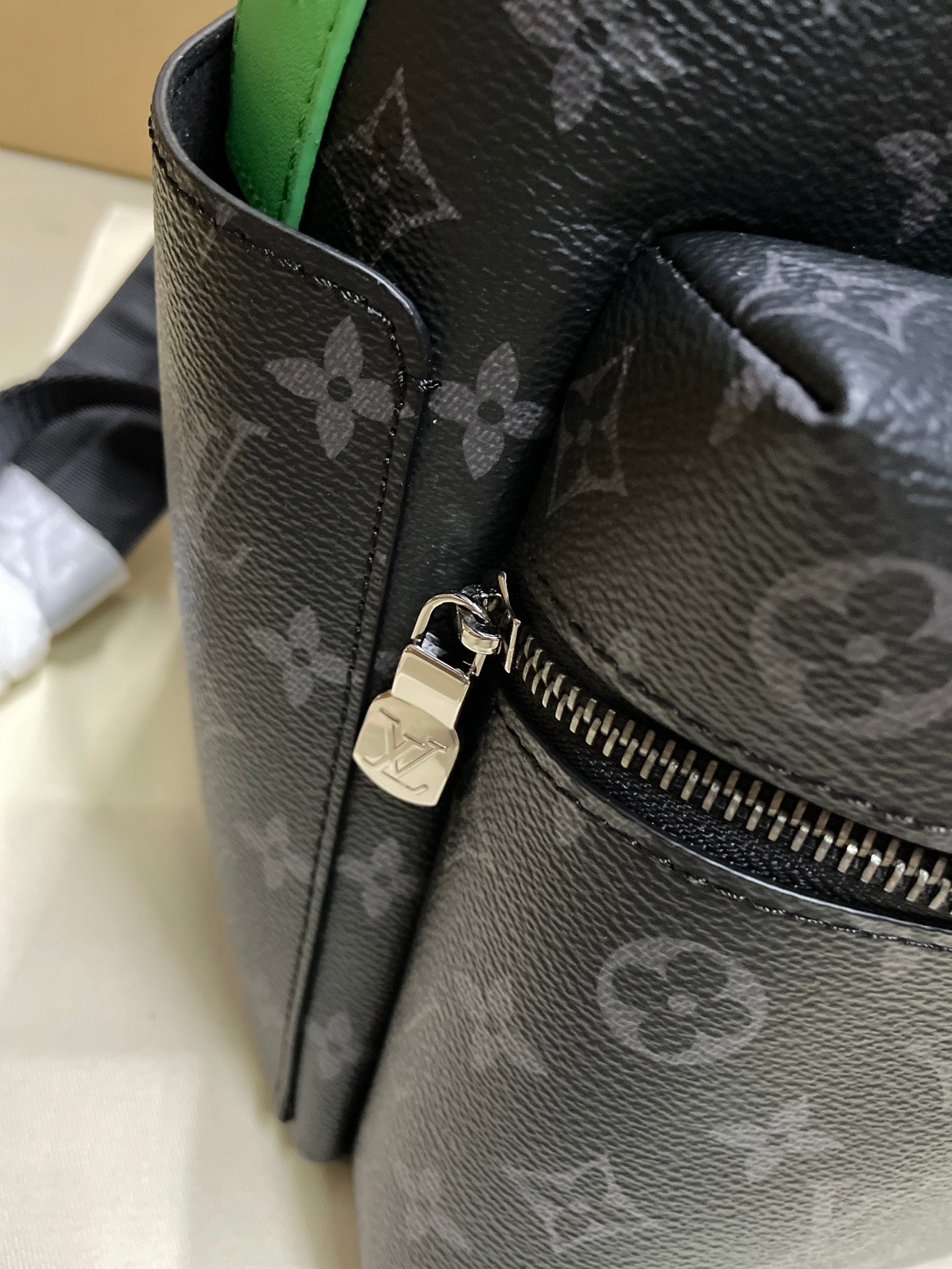 Louis Vuitton monogram mini backpack close-up with zipper detail and lock
