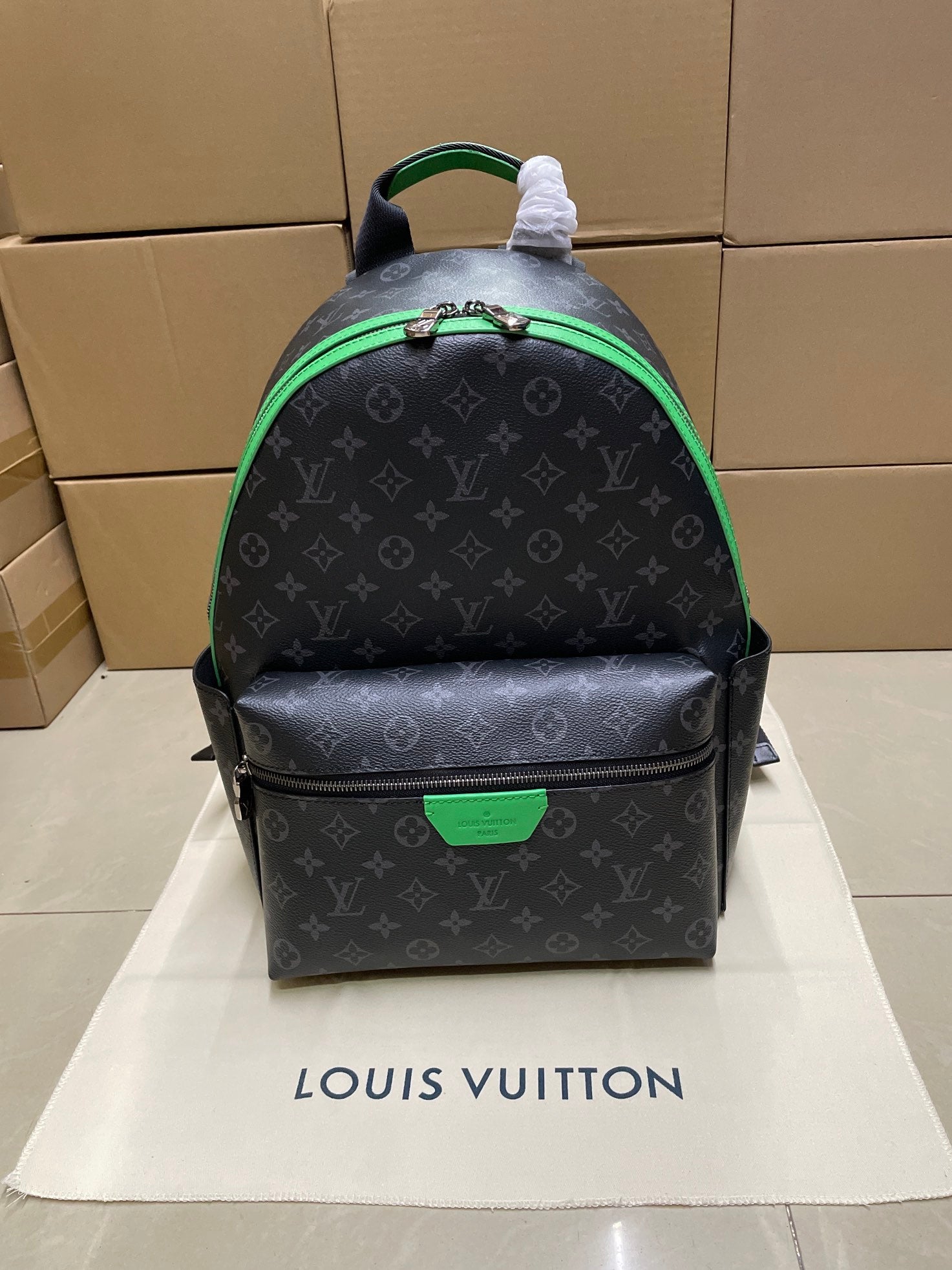 Louis Vuitton monogram mini backpack with green trim and top handle