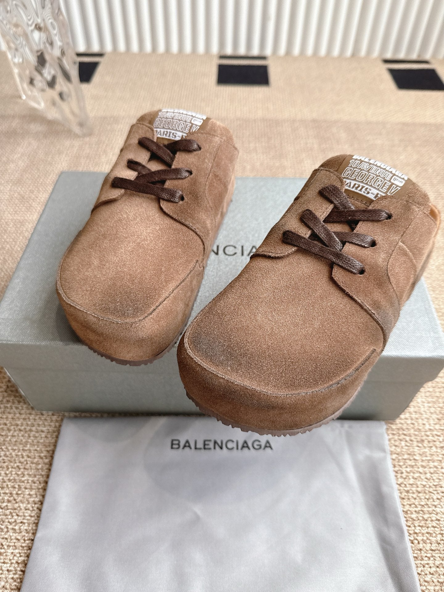 Brown suede lace-up sandals with toe strap, two shoes front view