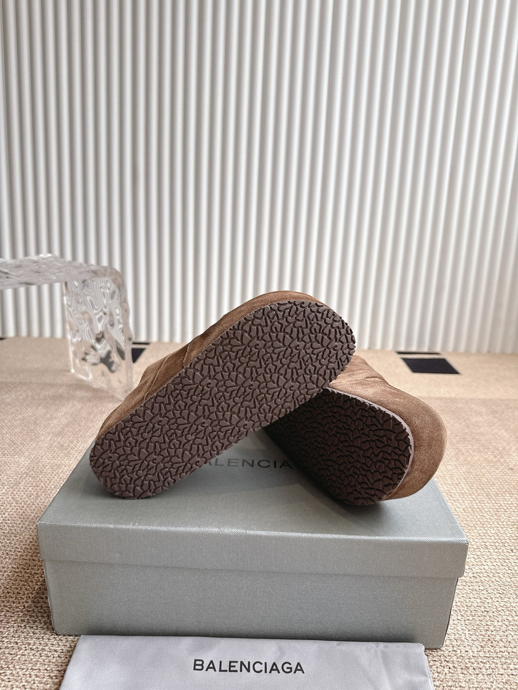 Brown suede sandals with textured rubber outsole, heel side view