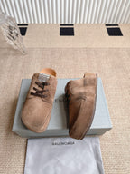 Pair of brown suede lace-up sandals with toe strap, front and side