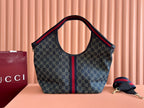 Tote bag in dark monogram canvas with central Web stripe, leather handles, and logo detail