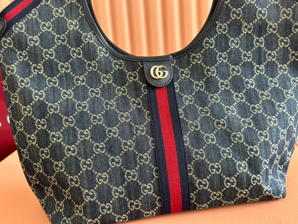 Tote bag front panel in dark monogram canvas with red and blue Web stripe and logo button