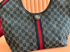 Tote bag front panel in dark monogram canvas with red and blue Web stripe and logo button