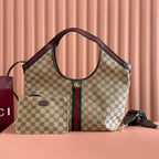 Gucci bag with beige GG canvas, green/red web stripe, dual top handles, structured silhouette