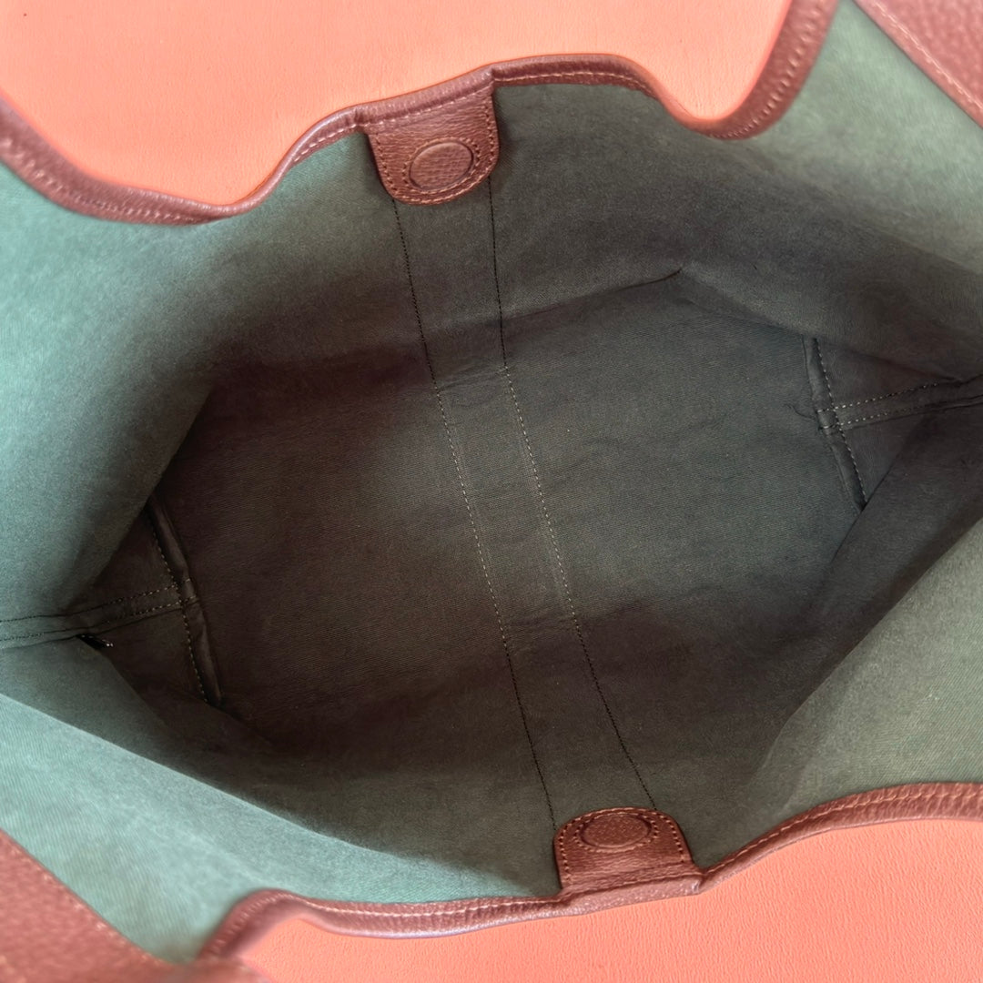 Gucci bag interior lining in green with brown leather trim and stitched seams
