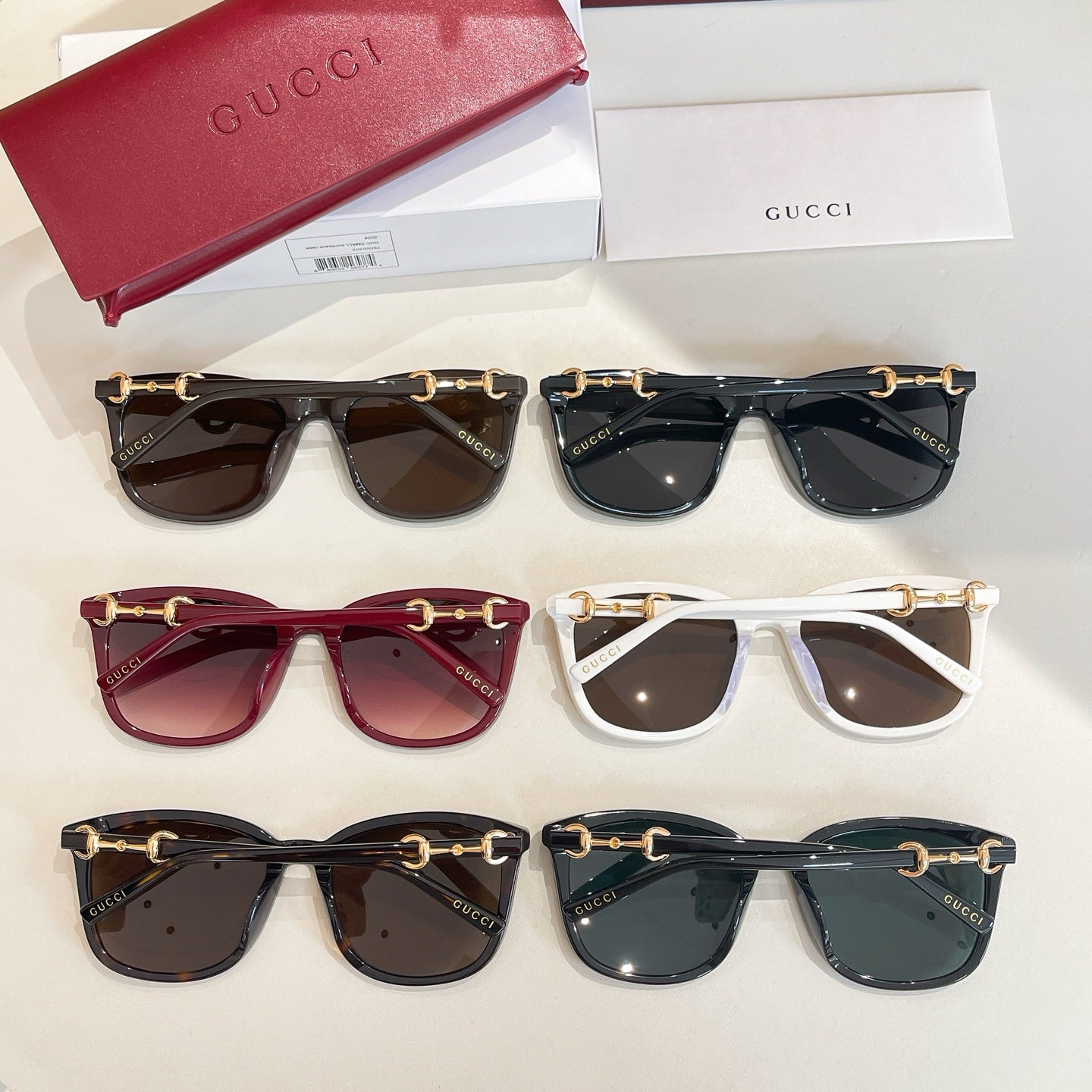 Assorted Gucci sunglasses set with six styles in dark, white, burgundy, and teal tones