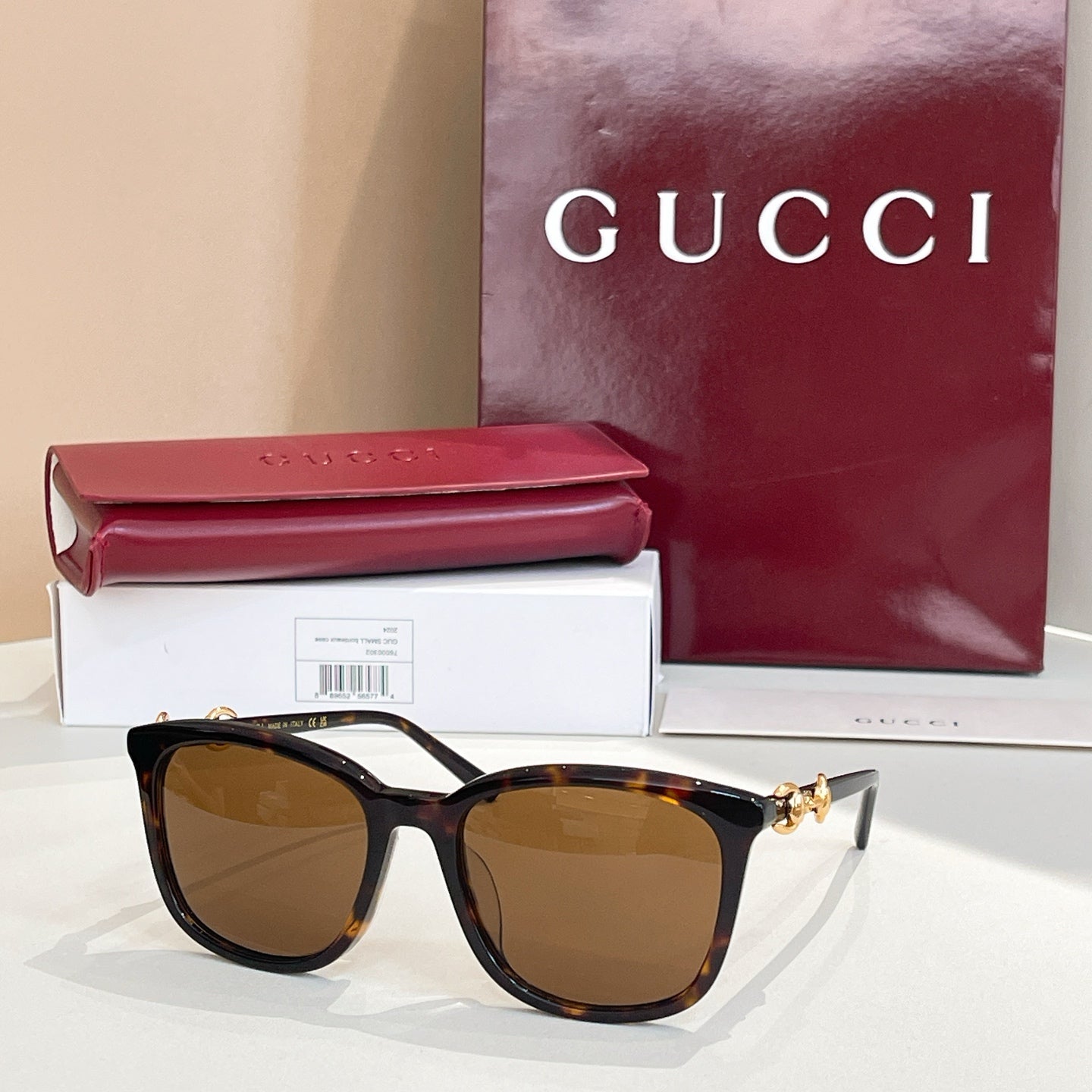 Gucci sunglasses with tortoiseshell frames and brown-tinted lenses