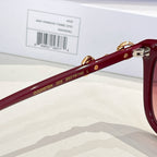 Gucci sunglasses side view with gold 'GU2057SK 005 560-19-145' marking on maroon temple