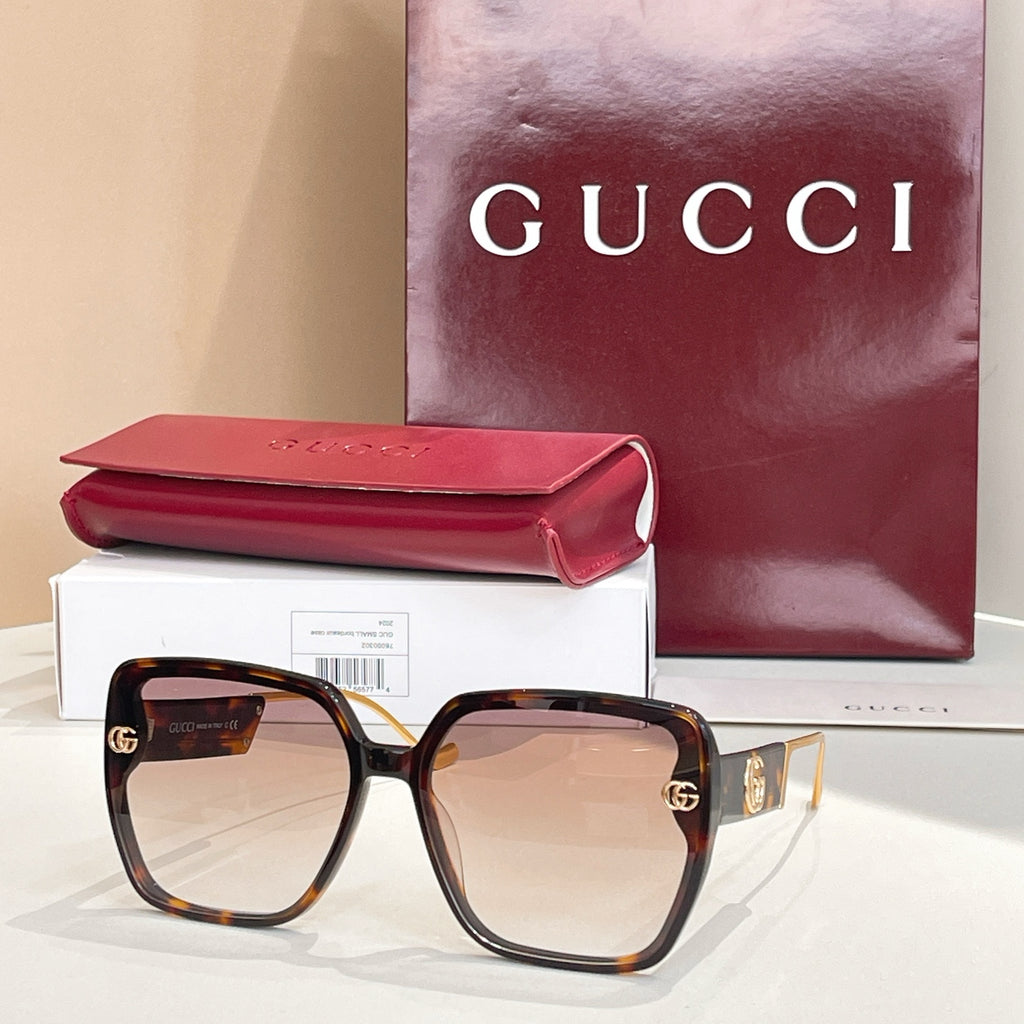 Tortoiseshell square sunglasses with tan gradient lenses and gold logo accents