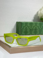 Gucci sunglasses with neon green oversized frames and tinted lenses